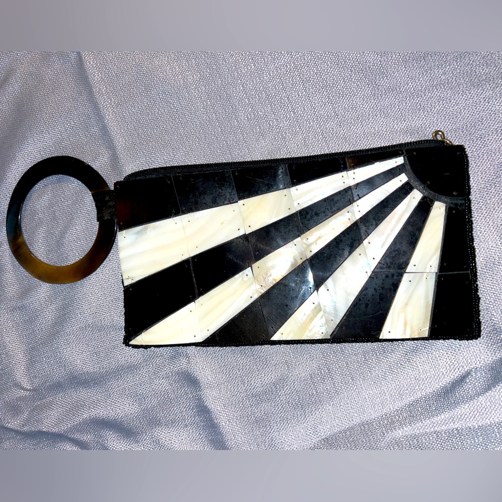 Sea Cove clutch- circle ring carry purse. Made out of sea shells. Never used.